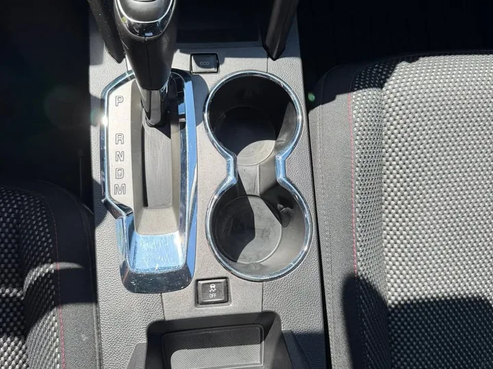 Clean Chevrolet Equinox center console and cup holders.