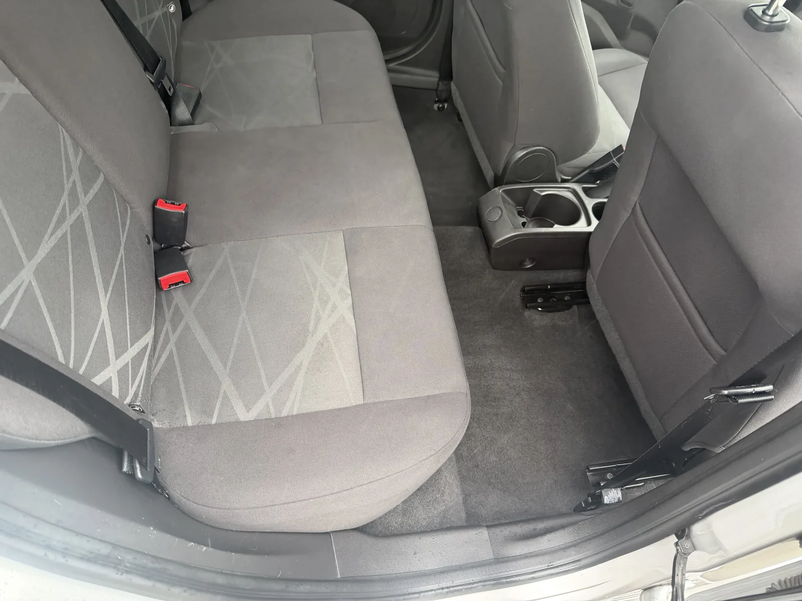 Clean Ford back seat and rear floor after interior detailing.