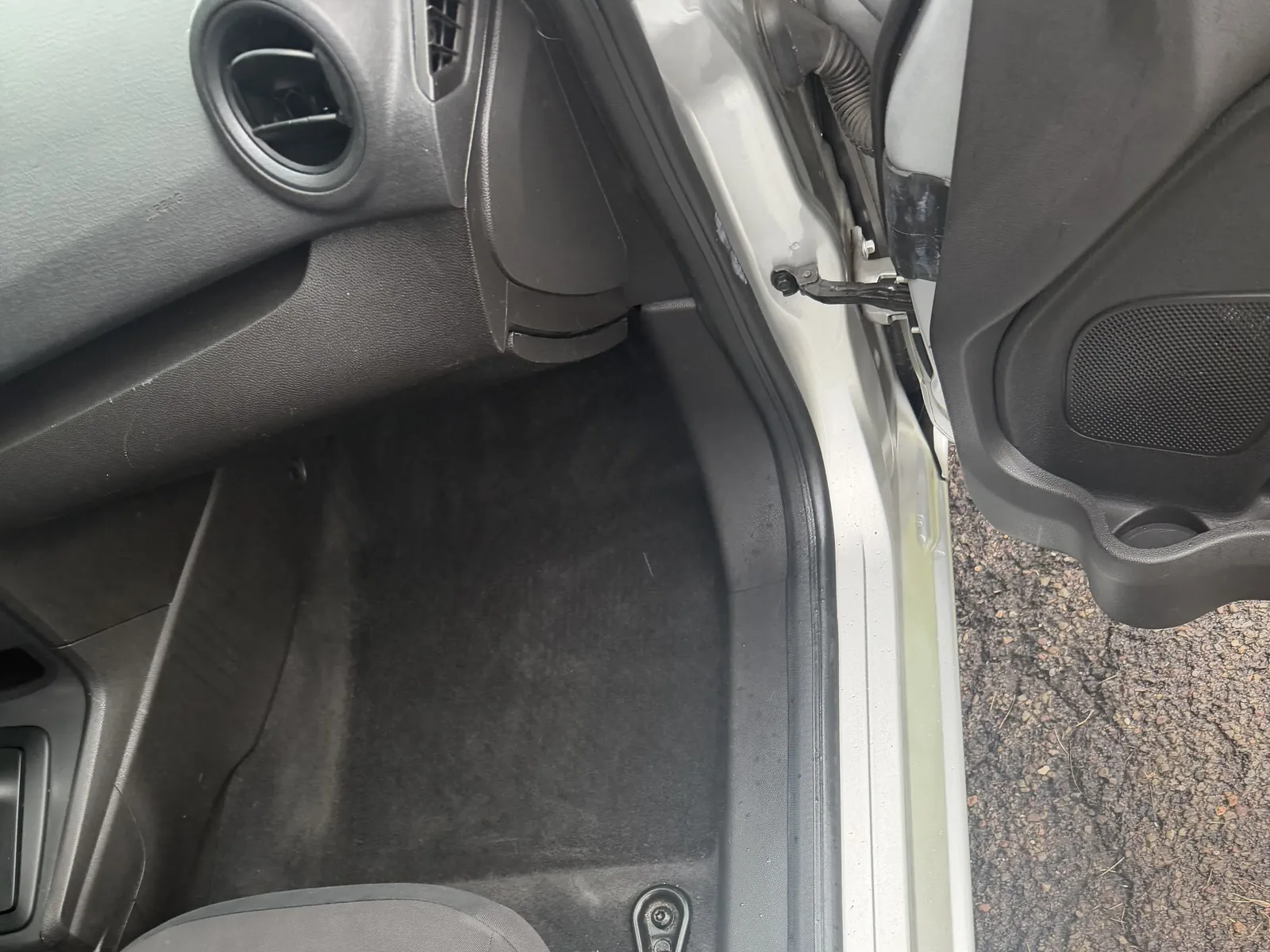 Ford front passenger area after interior detailing, with a cleaned floor and seat.