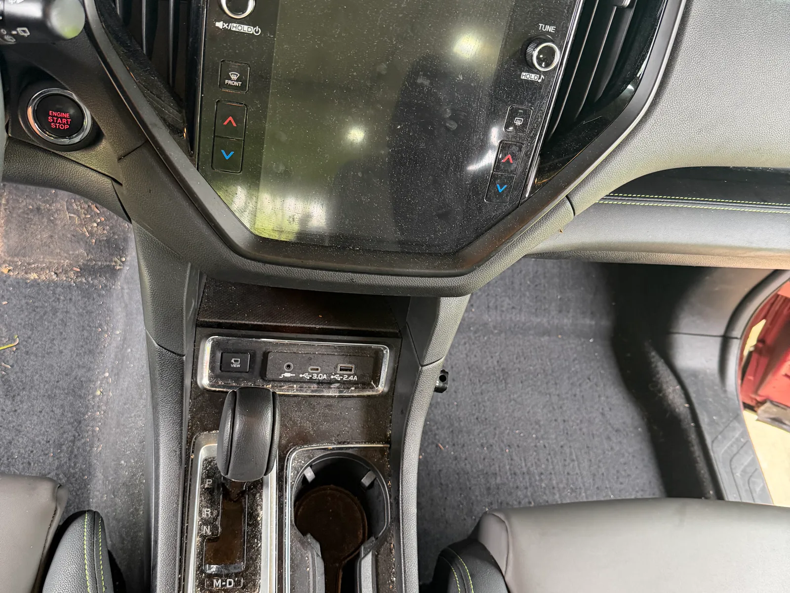 Subaru center console and cup holders before detailing.