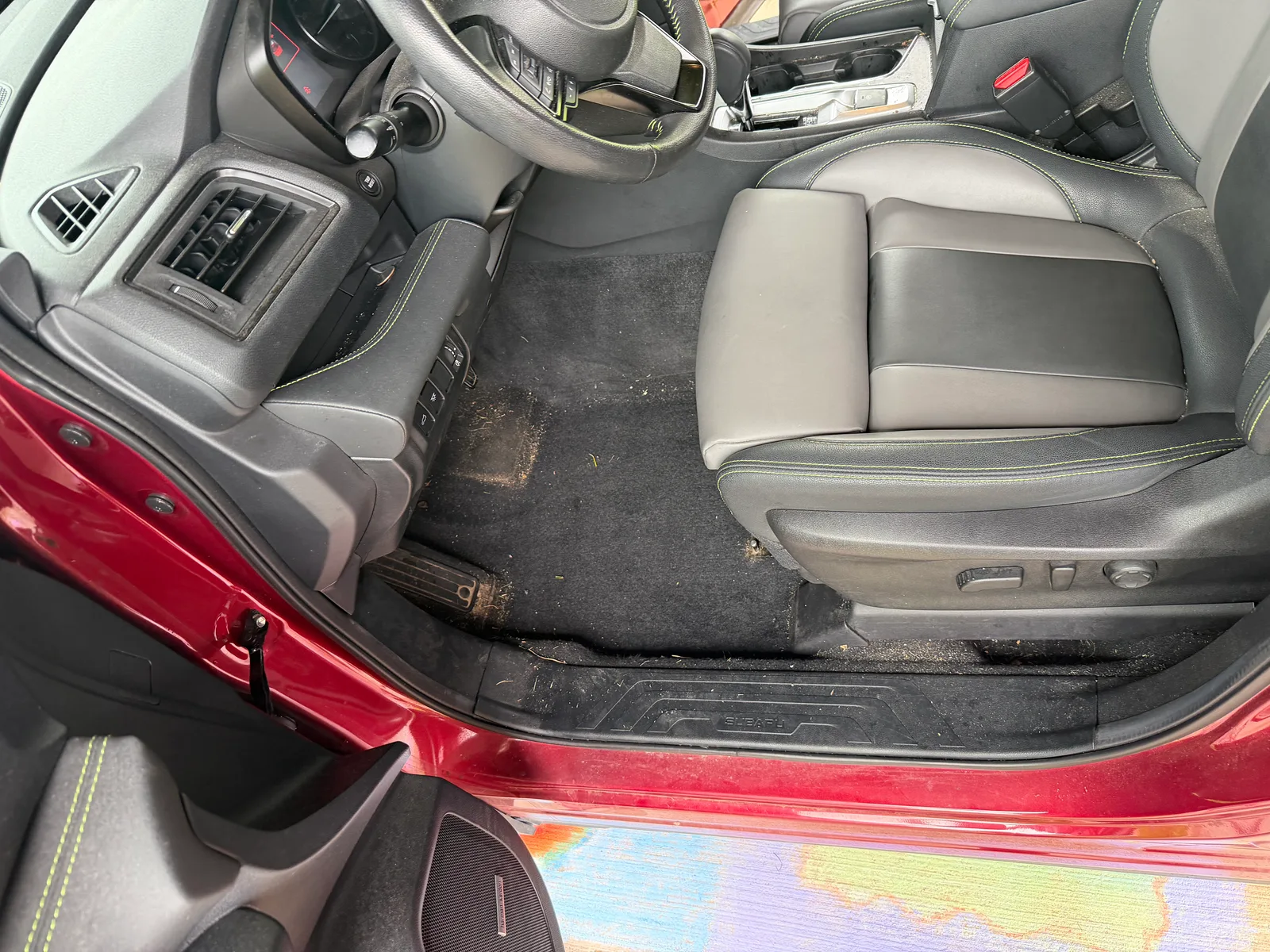 Subaru driver area before detailing.